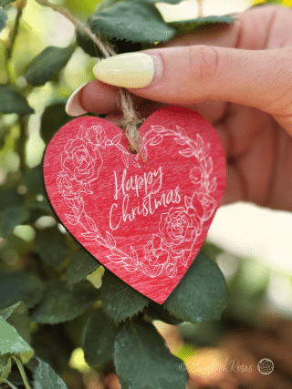 Red and white hanging heart shaped wooden gift tag keepsake saying 'Happy Christmas' - Eco-friendly gift wrap from English Roses