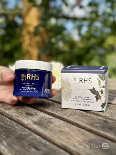 Body Cream - White Blooms Rose and Peony RHS The Flower Show Collection - A hand holding the body cream with the box