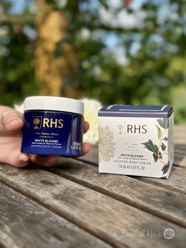 Body Cream - White Blooms Rose and Peony RHS The Flower Show Collection - A hand holding the body cream with the box