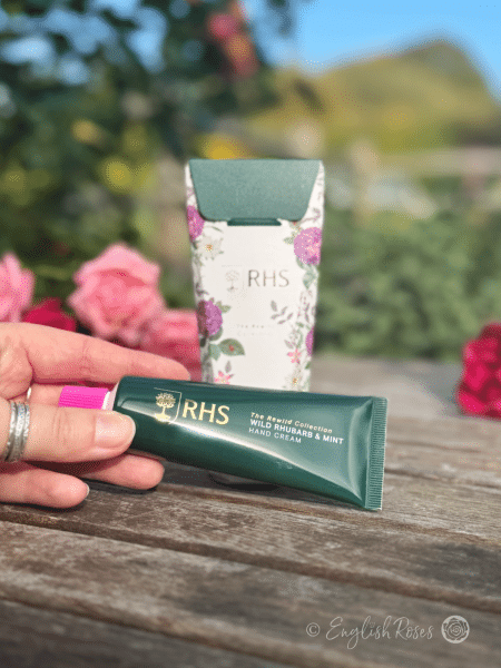 Hand Cream - Wild Rhubarb and Mint RHS The Rewild Collection - A hand holding the tube of hand cream