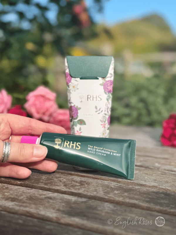 Hand Cream - Wild Rhubarb and Mint RHS The Rewild Collection - A hand holding the tube of hand cream