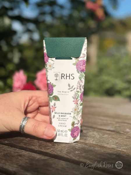 Hand Cream - Wild Rhubarb and Mint RHS The Rewild Collection - A hand holding the decorative box
